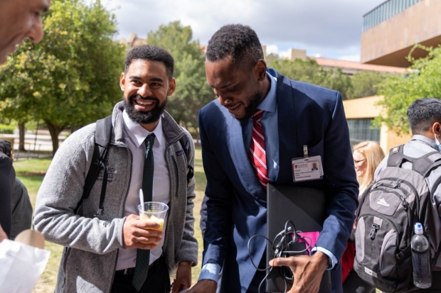 Nader Shayegh Chatting with another Member of the Summer 2022 Stanford–HBMC Med Student Cohort